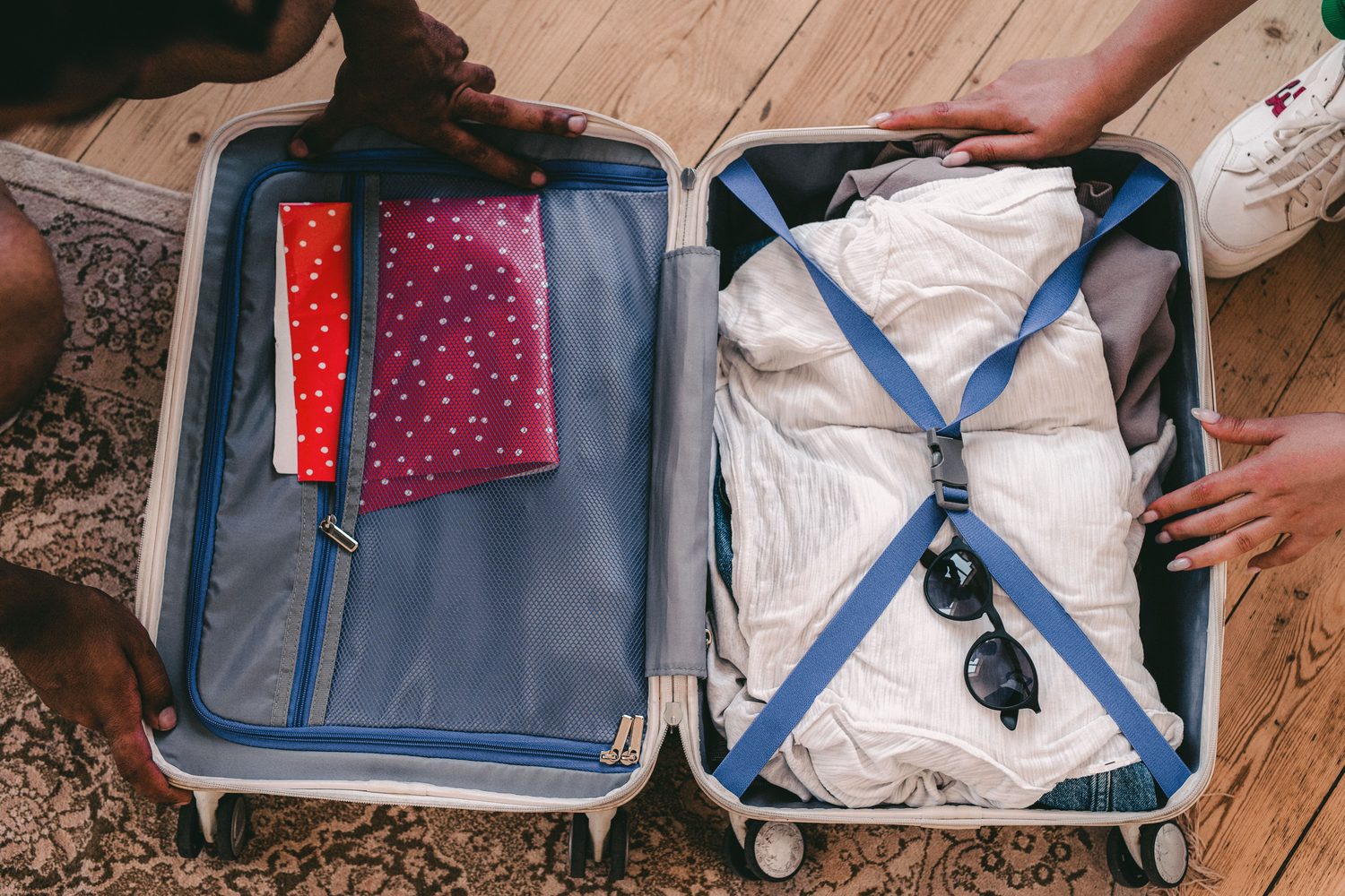 Woman wearing sunglasses in a travel case